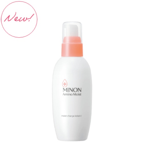 White bottle of Minon AminoMoist moisturizing lotion with a peach pump and clear lid, featuring a small pink circular 'New!' badge in the top-left corner.